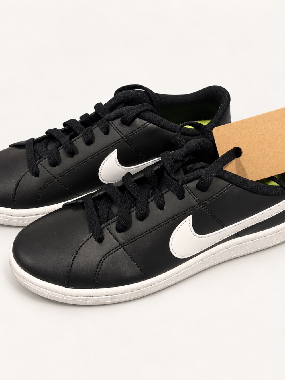 Nike Black Leather Low-Top Sneakers with White Swoosh